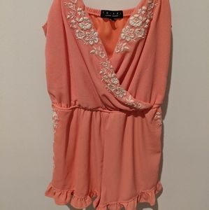 Coral romper with embroidery